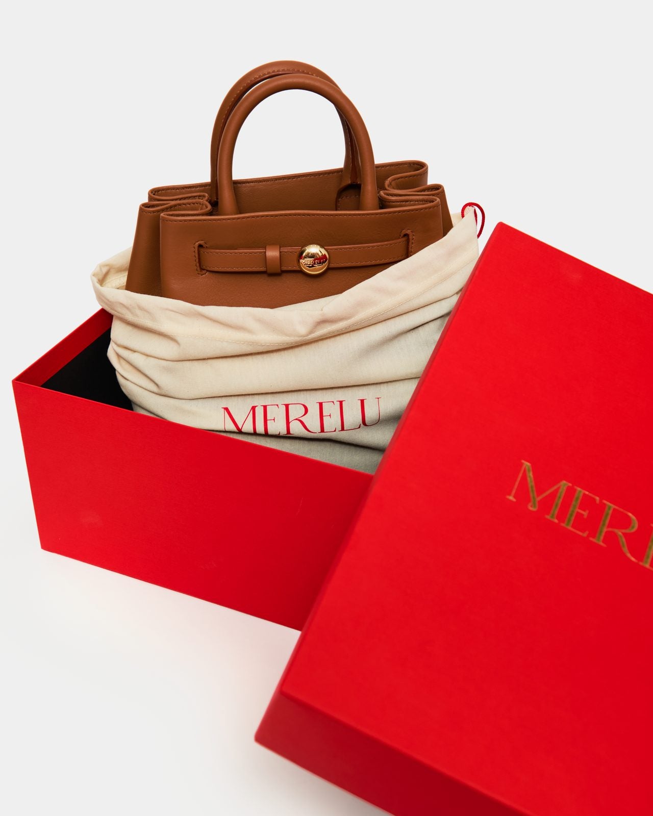 Packaging Merelu: caja, funda guardapolvo y bolso Origen